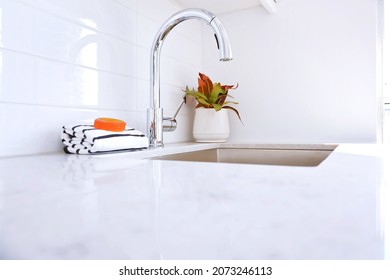 Elegant Stainless Steel Kitchen Faucet And Sink With White Tile Wall. Home Interior Background. Design Element.