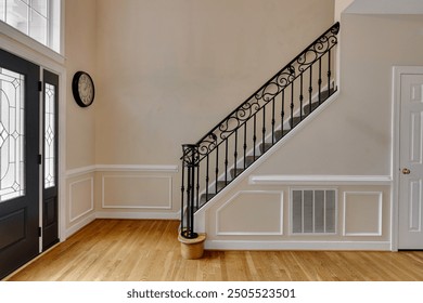 Elegant Staircase With Ornate Railing In A Brightly Lit Entryway Area - Powered by Shutterstock