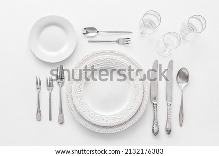 Elegant table setting on white background