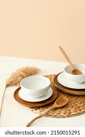 Elegant table setting with pampas grass on light background