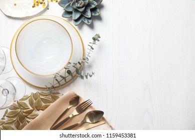 Elegant table setting and space for text on light background, top view