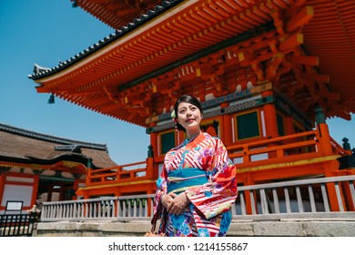 elegant traveler wearing beautiful kimono and visiting the temple in Japan. young tourist experience kimono clothing in Kyoto. traveler trip in jp concept.