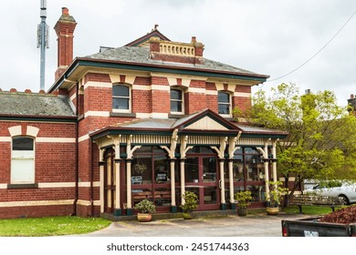 Elegant Vintage Brick House with Lush Greenery - Powered by Shutterstock