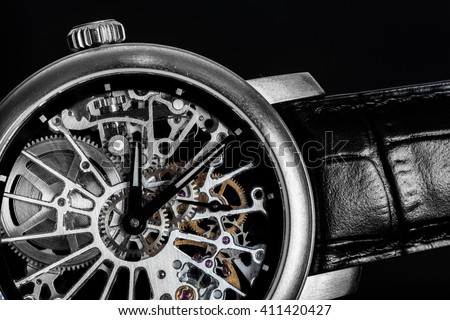 Elegant watch with visible mechanism, clockwork close-up. Luxury, men's vintage accessory. Time, fashion concept.