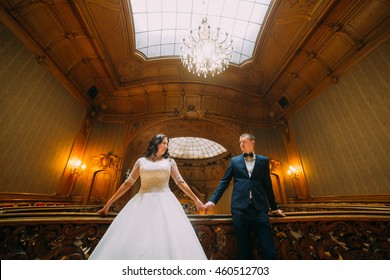 Elegant Wedding Couple Posing In Luxurious Interior Of Old Classic Mansion