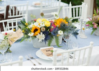 Elegant Wedding Reception Area, Ready For Guests And The Bridal Party. Rich Bunch Of Flowers Table.