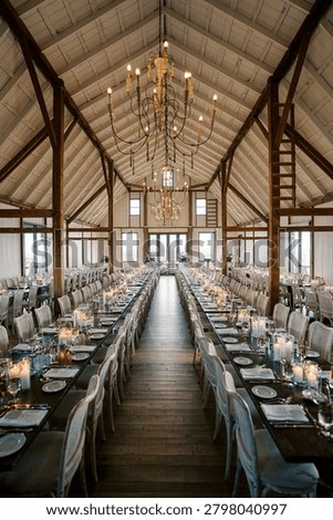 Elegant wedding reception setup in rustic barn venue