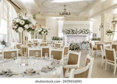 an Elegant wedding reception venue with sophisticated decor and floral arrangements - Powered by Shutterstock