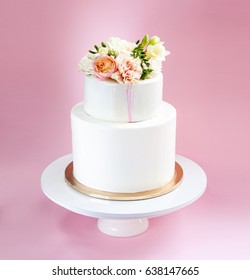 Elegant Wedding Tiered Cake Decorated With Fresh Roses And Freesia
