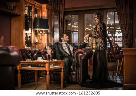 https://image.shutterstock.com/image-photo/elegant-welldressed-couple-luxury-interior-450w-161232605.jpg
