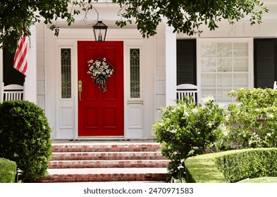 Elegant white house with bright red front door