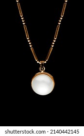 Elegant White Pearl Necklace Hanging On Black Background