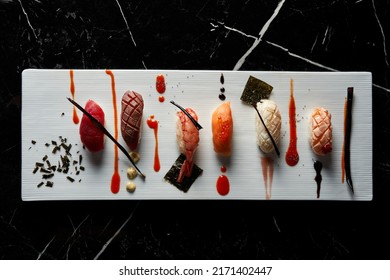 Elegant White Plate Of Sushi Pieces. Nigiri. Flat View. Food, Japanese Cuisine Concept.