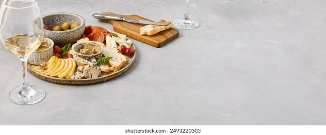 Elegant Wine Pairing Platter with Cheese, Olives, Sun-Dried Tomatoes, Pear, Honey, Fuet Sausage, and Pâte. - Powered by Shutterstock