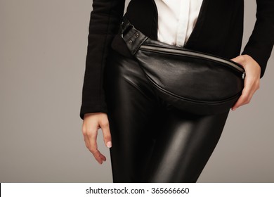 Elegant Woman With A Black Leather Fanny Pack