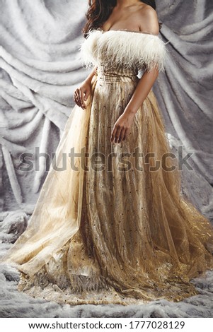 elegant woman in luxury golden yellow long gown evening dress