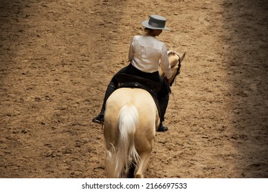 elegant woman on a horse running on the sand - Shutterstock ID 2166697533