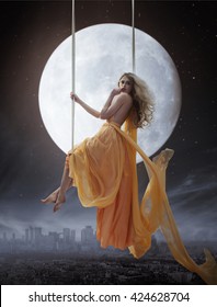 Elegant woman over big moon background