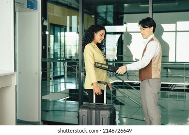 Elegant Woman Passing Through Metal Detector Scanner In Airport Terminal.