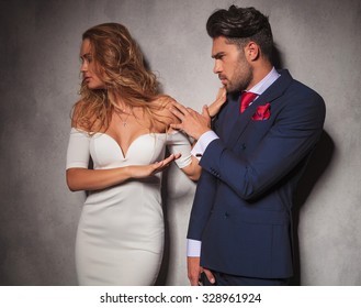 Elegant Woman Is Pushing Her Man Away While He Tries To Talk Her Out Of It, Studio Picture