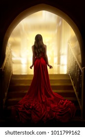Elegant Woman Silhouette in Long Red Gown, Lady Back Rear View, Fashion Model Dress Fabric Waving on Stairs