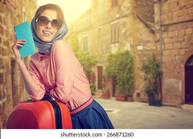 Elegant Woman With A Suitcase Travel And Ticket On Street Of Italian City