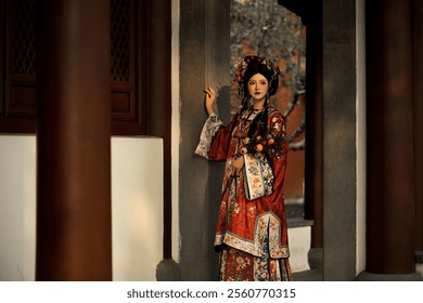 Elegant Woman in Traditional Chinese Hanfu Dress Posing Gracefully in Historic Courtyard with Ornate Details and Warm Lighting. - Powered by Shutterstock