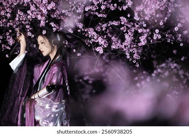 Elegant Woman in Traditional Silk Robe Among Blooming Cherry Blossoms at Night – Ethereal Beauty Amid Soft Pink Petals and Moonlit Serenity. - Powered by Shutterstock