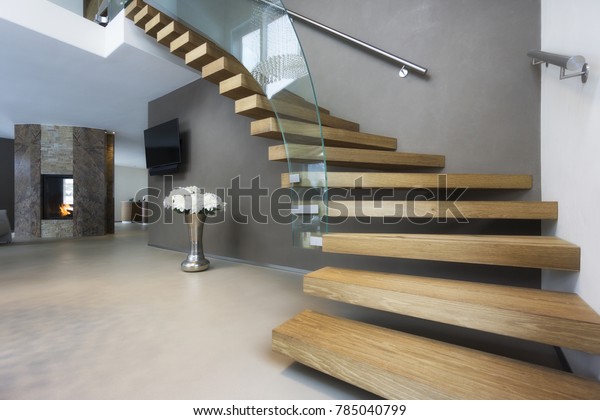 elegant wood and\
glass staircase in luxury\
home