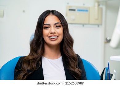 Elegant Young Adult Woman Sitting In Dental Chair, Dental Braces Concept 