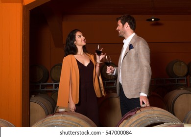 Elegant Young Couple Wine Tasting Sightseeing Tour Visiting Winery Cellar