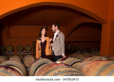 Elegant Young Couple Wine Tasting Sightseeing Tour Visiting Winery Cellar