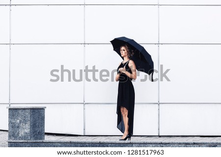 Similar – Blonde thin woman with hat and sunglasses visiting the city during the day.