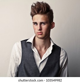 Elegant Young Handsome Man. Studio Fashion Portrait.