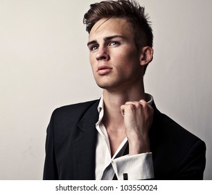 Elegant Young Handsome Man. Studio Fashion Portrait.