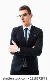 Elegant young handsome man, in suit and glasses, posing on white background