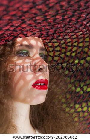 Similar – Young redhead woman covering from sun