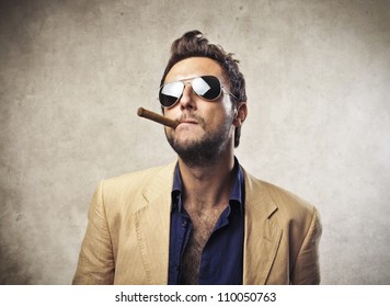 Elegant Young Man Smoking A Cigar