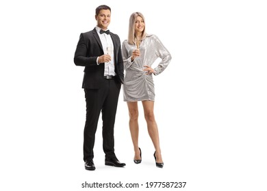 Elegant young man and woman holding glasses of sparkling wine isolated on white background