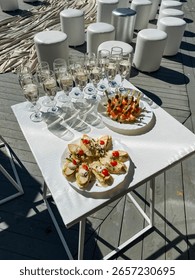An elegantly arranged dining table features beautifully crafted plates of delicious food and exquisite wine glasses, creating a warm atmosphere perfect for enjoying meals together