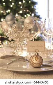 Elegantly Lit Holiday Dinner Table With Focus On Place Card