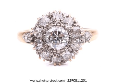 An elegantly styled diamond cluster ring. Isolated on white.