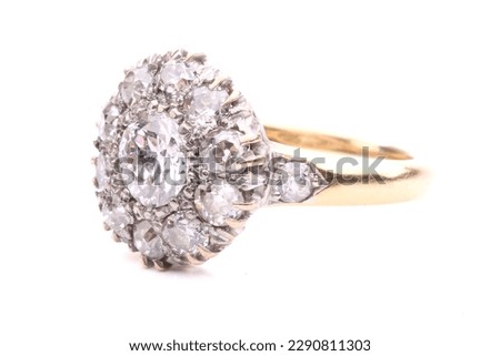 An elegantly styled diamond cluster ring. Isolated on white.