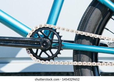 Element BMX-bike: front sprocket bicycle with a connecting rod and a chain. Closeup side view.