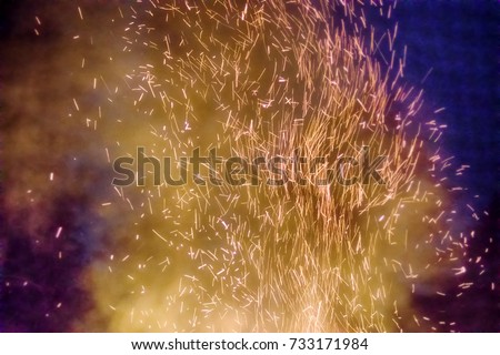 Element of fire, huge night fire on holiday. Whirl of sparks. Sparks dance and pyromania as choreographic idea. Fire worship, Zoroastrianism (Zarathustra adoration)