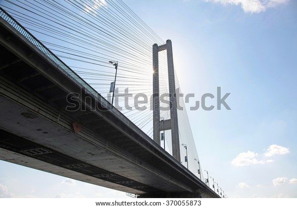Element rope suspension bridge. The\
sun shines on the beautiful rope suspension\
bridge.