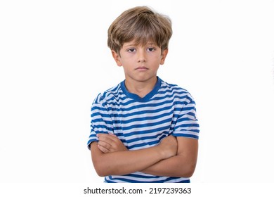 Elementary Age Boy On A White Background With An Angry Facial Gesture