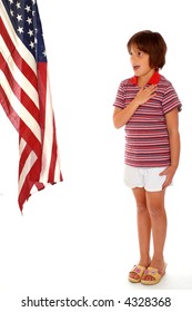 Elementary girl saying the Pledge of Allegiance toward a large American Flag.  Isolated on white.