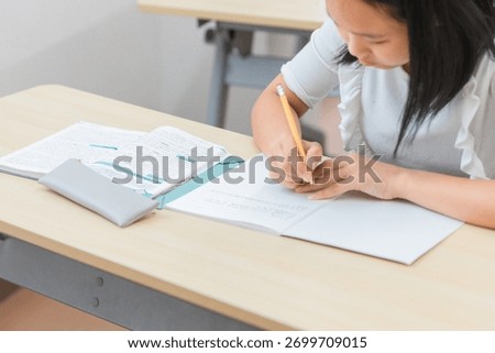 Elementary and junior high school students studying at school or cram school