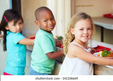 Elementary Pupils Collecting Healthy Lunch In Cafeteria